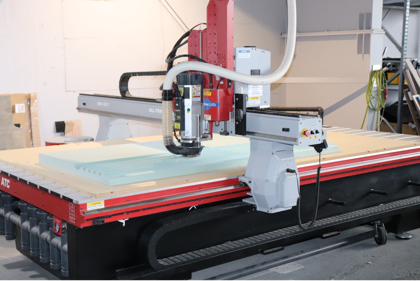 CNC 3-Axis Router with a routing area of 6’x10’x6” with accuracy of +/-0.010”